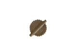 Vintage African Baule bead with a textured, concentric spiral pattern and aged bronze finish.