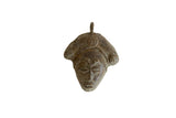 Handmade vintage African bronze mask pendant with a stylized face and textured patina.