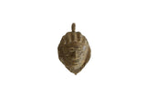 Vintage African bronze mask pendant with a textured, weathered finish and stylized features.