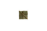 Vintage African square handmade bronze coin with greenish patina, geometric pattern.