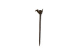 Vintage African bronze bird pin with a rustic, handmade texture and a long, tapered shaft.