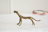 Collectible vintage African bronze cheetah figurine, detailed handmade texture.