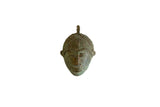 Vintage African Oxidized Mask Pendant with a textured surface and aged, greenish patina.
