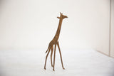 Vintage African bronze giraffe with unique hand-forged texture and aged patina.
