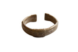Antique African bronze stripe design cuff bracelet with a rustic, aged patina.