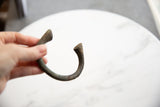 Antique African manilla bracelet with unique handcrafted U-shape and deep patina.