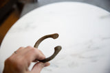 Curved antique African bronze manilla cuff showing unique aged patina.