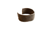 Antique handmade African bronze cuff with an incised stripe design and a rich, aged patina.