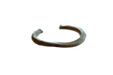 Antique African bronze cuff bracelet with hand-carved geometric detailing and a deep patina.