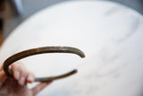 Angled view focusing on the geometric engravings of the handmade bronze artifact.