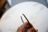 Fine geometric details etched into the surface of the vintage bronze collectible.