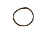 Vintage African bronze artifact in a circular shape with a deep, time-worn patina.