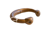 Antique African copper alloy snake cuff bracelet with a deep patina and faceted ends.