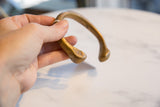 Antique African bronze cuff bracelet end, revealing geometric etching and rich patina.