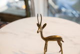 Close-up of the vintage African bronze left-facing gazelle's textured head and horns.