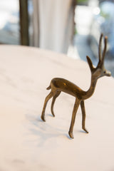 Aged bronze texture on the legs and lower body of the vintage African gazelle.