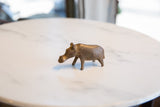 Side view of the vintage African bronze hippo, highlighting its simple, sturdy form.