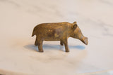 Side profile of a vintage African bronze hippo highlighting its textured, rustic patina.