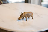 Aged patina and handmade texture on a vintage African bronze alloy hippo sculpture.