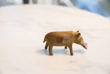 Vintage African bronze hippo sculpture shown in profile with a weathered patina.