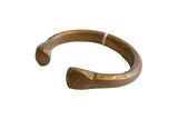 Antique African bronze snake cuff bracelet with a hand-forged form and a dark, time-worn patina.