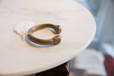 Antique bronze snake cuff bracelet with a rich, aged patina and substantial C-shaped form.