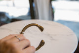 Hand-etched linear and dotted patterns on the antique African snake cuff end.