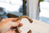 Aged bronze patina and incised details on the handcrafted snake cuff terminal.