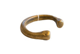 Early 19th-century African bronze snake cuff with a carved head and time-softened patina.