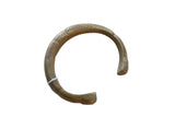 Antique handmade African bronze snake cuff bracelet with a golden patina and etched details.
