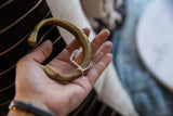 A close look at the inscribed markings on the inner surface of the antique bronze cuff.