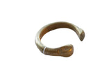 Antique African bronze snake cuff bracelet with a smooth, aged golden patina.