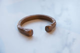 The solid, squared ends and rich patina of an antique African copper cuff.