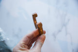 Fine incised dot markings on the tip of an antique African copper cuff.