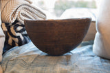 Antique handmade African wooden bowl, dark brown, subtle carved geometric patterns, 11 inches.