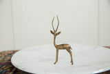 Slender form and textured bronze surface of a vintage African gazelle.