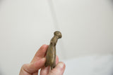 Profile view of the vintage bronze hippo's head highlighting its aged, handmade texture.