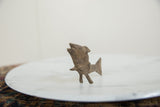 Side view of the vintage African bronze fish, detailing its sculpted form and rustic texture.