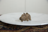 Angled view showcasing the charming, textured body of a vintage bronze hippo.