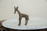 Aged patina and textured surface on the vintage African bronze antelope.