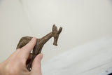Handmade texture on the aged bronze surface of a vintage African antelope.