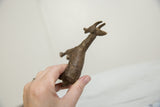 Vintage African bronze antelope head with unique, hand-chiseled texture and warm patina.