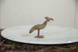 Side profile of a vintage bronze Kori bustard bird with a textured, aged finish.