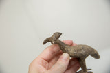 Detailed profile of the vintage bronze bustard bird, highlighting its rustic, textured patina.