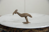 Side profile of a vintage bronze Kori bustard bird highlighting its hand-etched details.