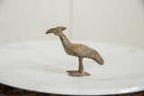 Side profile of a vintage Kori bustard bird showing its textured, aged bronze patina.