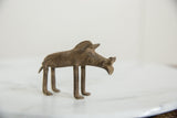 Close-up of the vintage African bronze warthog's textured head and snout.