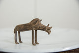 Handmade bronze warthog collectible showing its rustic texture and stylized tusks.