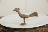 Side view of a collectible long-tailed African bird sculpture in aged, textured bronze.