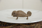 Handmade African bronze chameleon sculpture, detailed with textured scales and coiled tail.